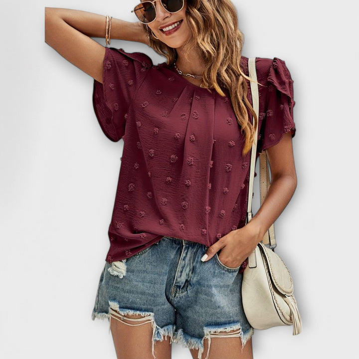 Charlotte - Den perfekte polkaprikkede bluse